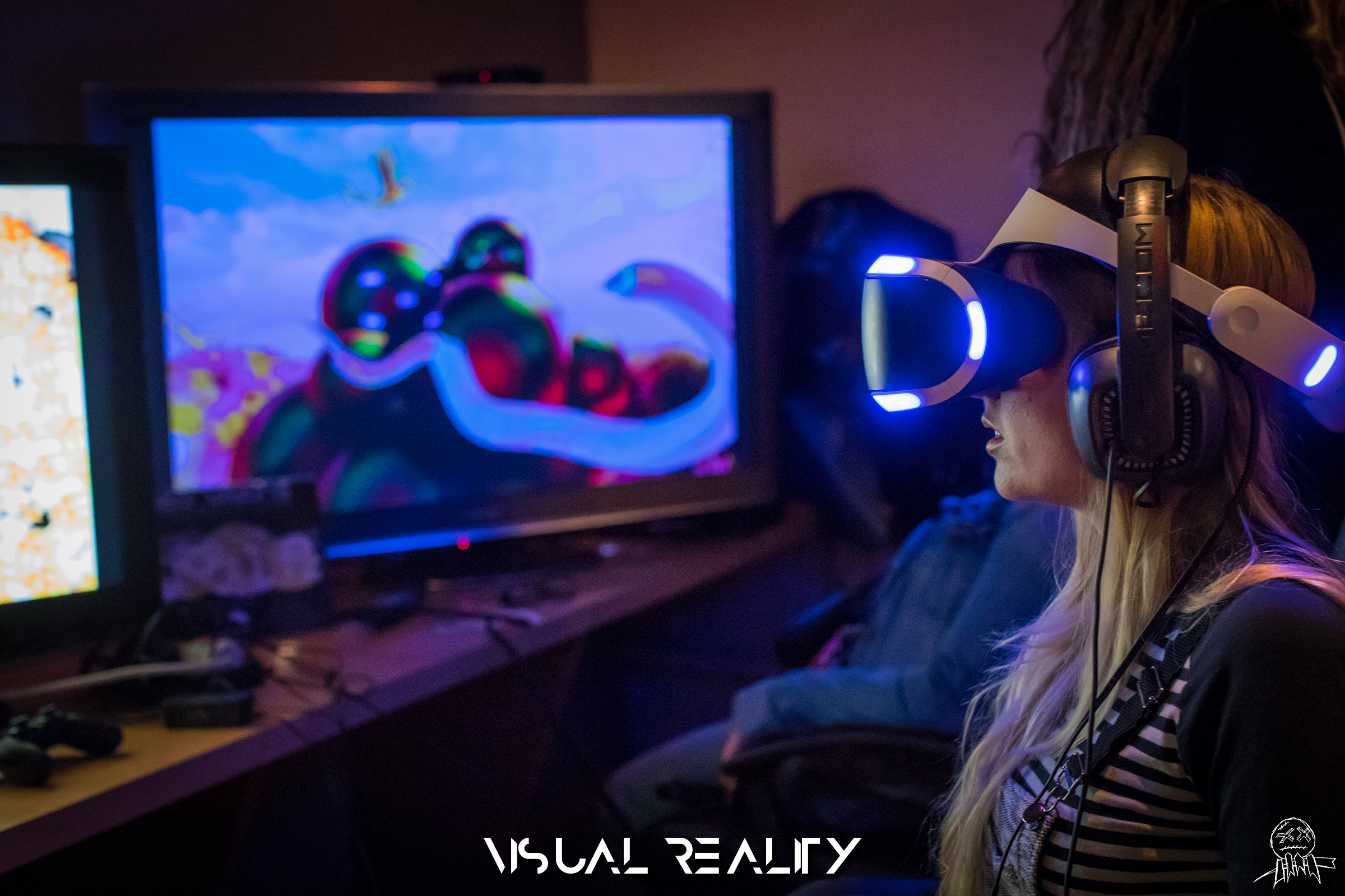 Person experiencing VR with colorful display on screen