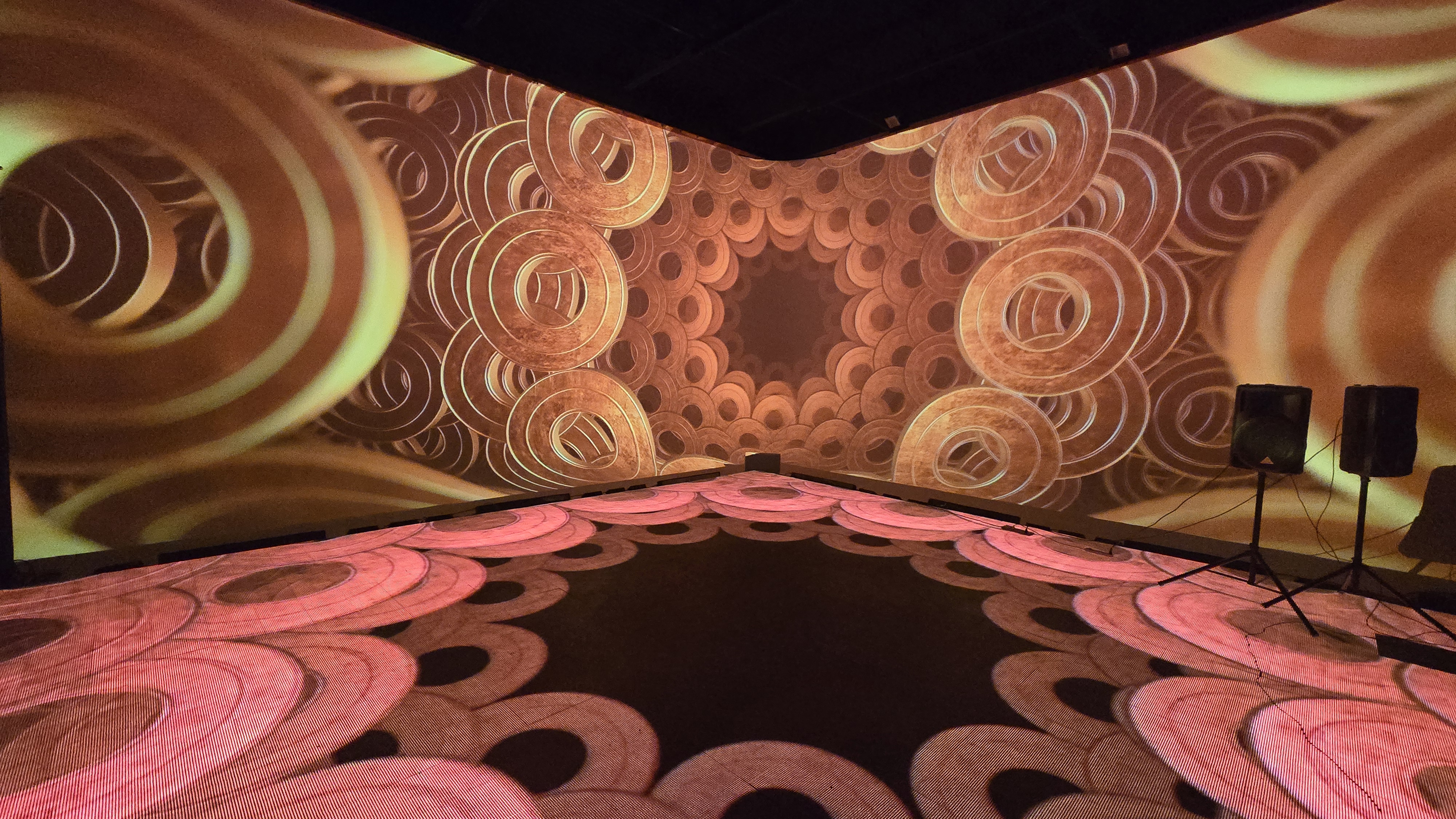 Warm copper spiral patterns with rose floor reflections